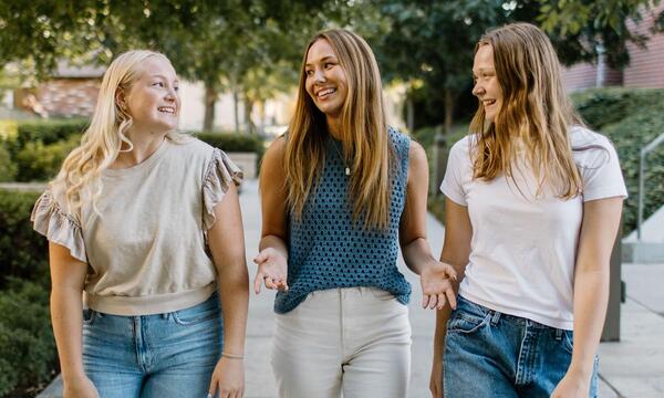 three young women smiling